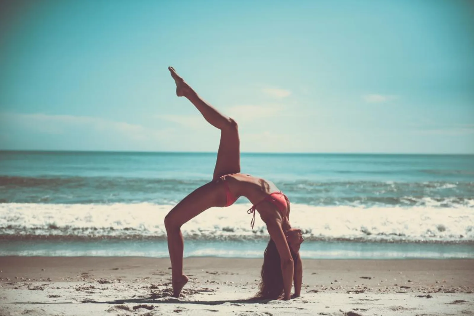 Yoga on a beach at sunrise